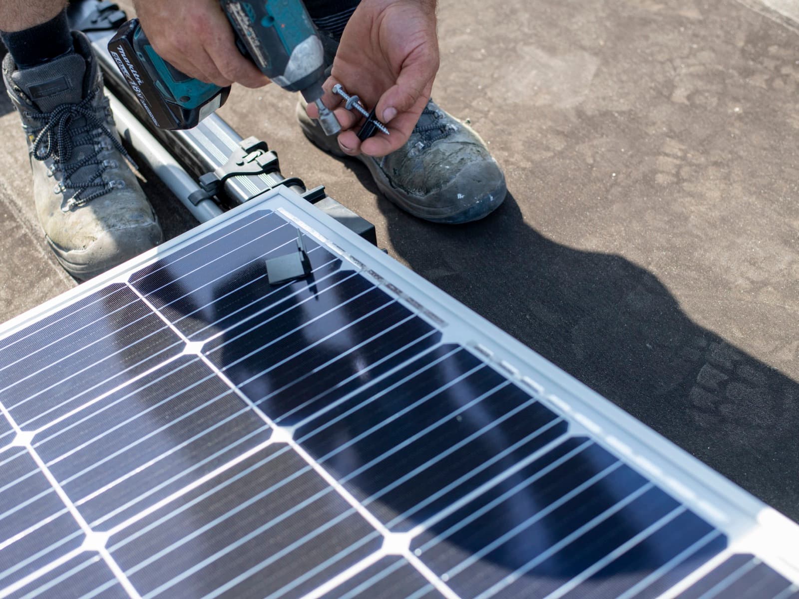 Solar panel installation on building roof.